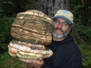Paul Stamets holding the rare Agarikon mushroom